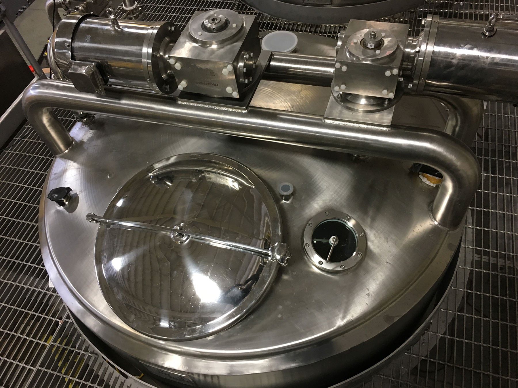 Batching tank mixer with stainless steel construction and transparent lid, showcasing food processing equipment for automation solutions by CHL Systems.