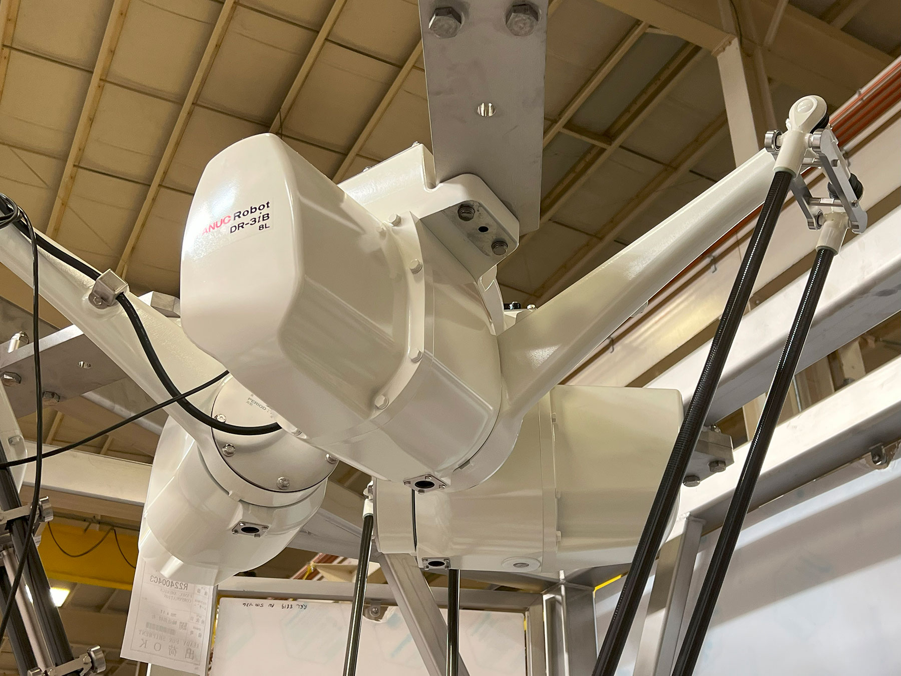 Robotic pick and place arm from CHL Systems, showcasing automation technology in food processing and material handling.