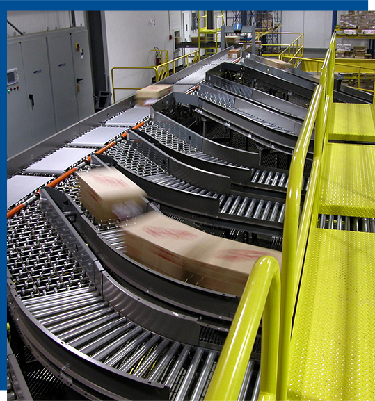Conveyor system with curved sections transporting boxes, highlighting advanced material handling technology for efficient operations in manufacturing and food industries.